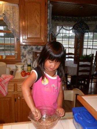 Kasen cleaning the brownie bowl